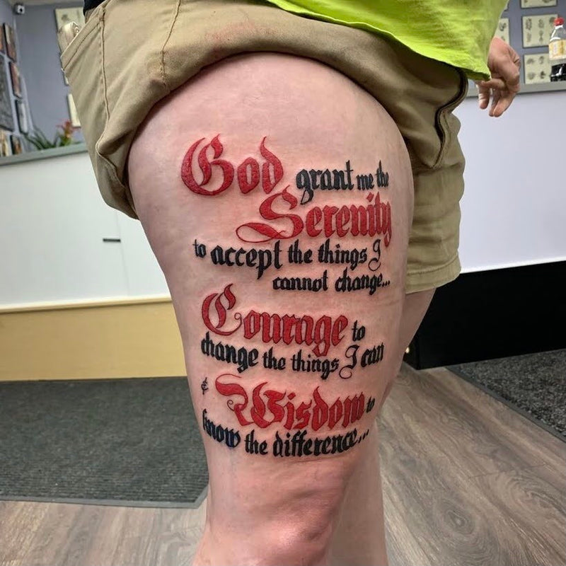 Tattoo of the Serenity Prayer on client’s thigh by Nick Young in Kansas City 