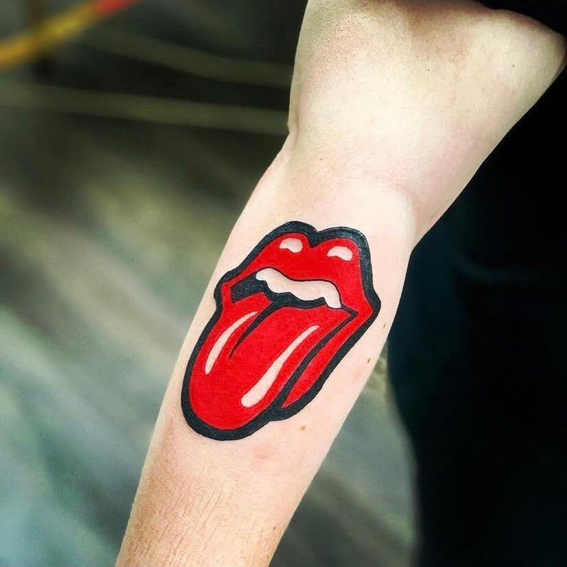 Rolling Stones logo tattoo on forearm by Nick Young in Kansas City